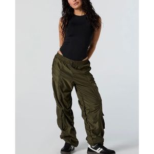 New with Tags Charlotte Russè pants, ruched side all the way up on both sides